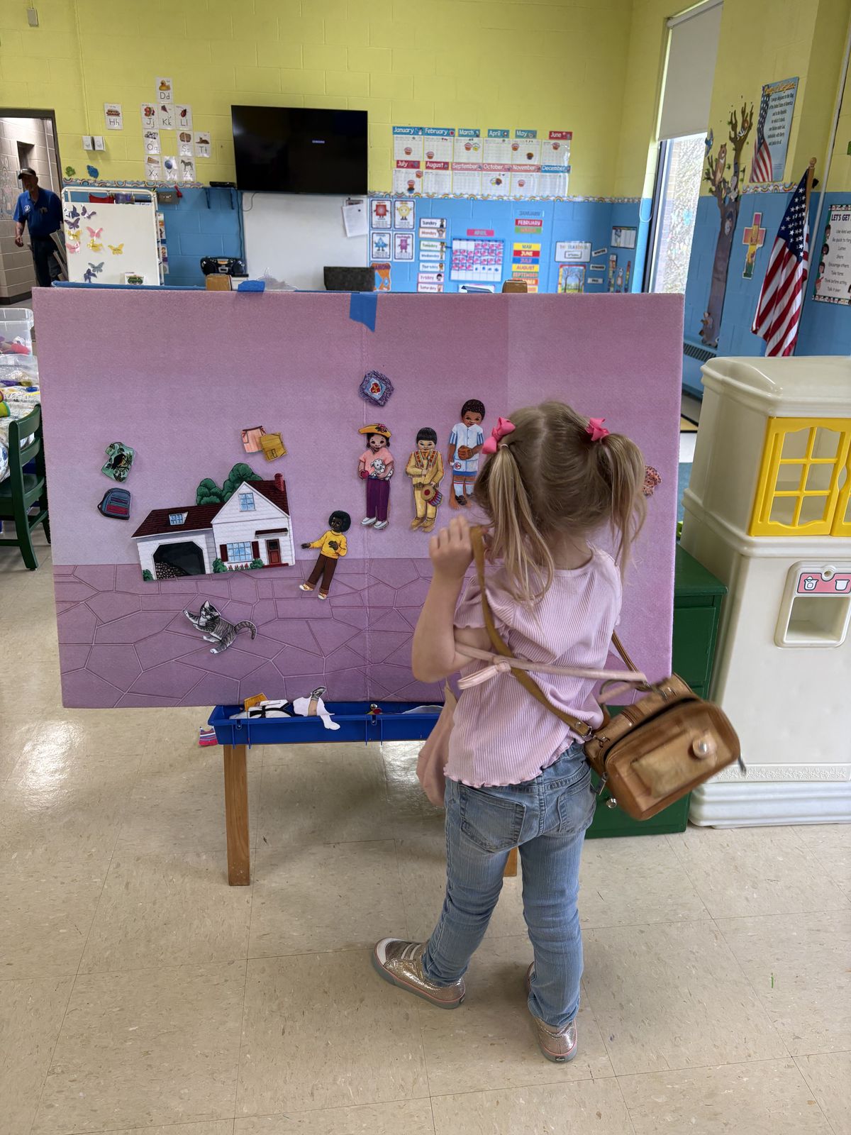 Student playing with felt board activity in the classroom at Noah's Ark Preschool Lapeer